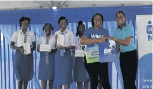  ?? ?? Ann Bolt (right), Acting Community Relations Manager – Eastern, assists in presenting prizes to Marymount High School for winning the video competitio­n.