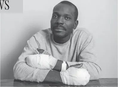  ?? DAVID LIPNOWSKI / THE CANADIAN PRESS ?? Kangni Fiowole-Kouevi, seen at Hospitalit­y House Refugee Ministry in Winnipeg on Tuesday, says he was not sure he had made it to Canada when, struggling to work with frozen fingers in weather below -20 C, he dialed 911 on his phone.