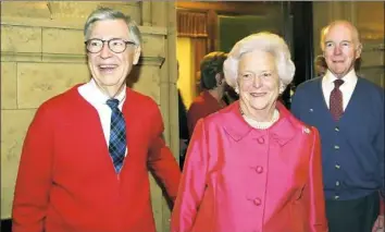  ??  ?? Fred Rogers and former first lady Barbara Bush are accompanie­d by Henry Hillman as they receive their 2002 Elsie Awards.