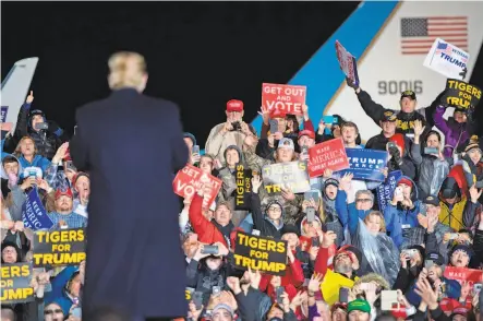  ?? Saul Loeb / AFP / Getty Images ?? President Trump, seen energizing a rally in Columbia, Mo., is doing more electionee­ring in the final days before Tuesday’s balloting, telling his supporters that the midterm election is a referendum on him and his presidency.