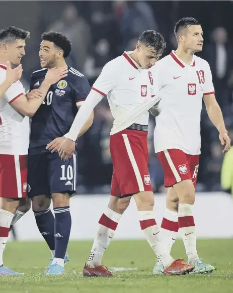  ?? ?? 2 Che Adams is surrounded by Poland players at the end of Thursday night’s 1-1 friendly draw at Hampden. Adams says the result against a higherrank­ed team ‘shows you the leaps and bounds this team has come on’