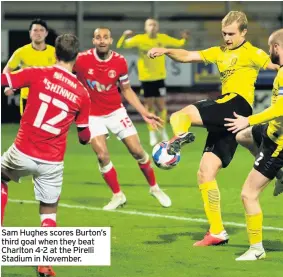  ??  ?? Sam Hughes scores Burton’s third goal when they beat Charlton 4-2 at the Pirelli Stadium in November.