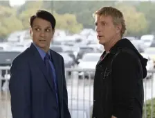  ??  ?? OLD ADVERSARIE­S: Ralph Macchio and William Zabka, from left, reprise their roles from the original ‘Karate Kid’ movies in ‘Cobra Kai.’