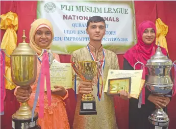  ?? Photo: Waisea Nasokia ?? From left: Zakira Bibi (Suva Muslim College) Sayad Ahsan (Suva Muslim College), and Suaidah Nisha Khatoon with their trophies during the Fiji Muslim League National Finals at the Nadi Muslim College on March 25, 2018.