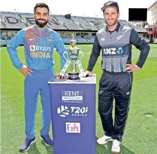  ?? — NEW ZEALAND CRICKET ?? Virat Kohli and his New Zealand counterpar­t Kane Williamson pose with the T20 trophy.