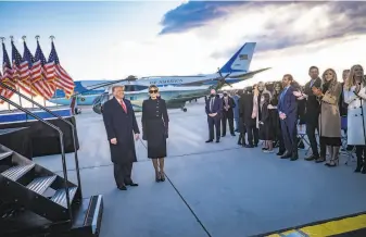  ?? Pete Marovich / Getty Images ?? A Nixonera standard of the “outer perimeter” of authority may apply to President Donald Trump, shown preparing to board Air Force One with first lady Melania Trump on Jan. 20.