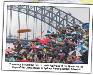  ?? ?? Thousands braved the rain to catch a glimpse of the Queen on the steps of the Opera House in Sydney.
Picture: Nathan Edwards