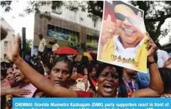  ??  ?? CHENNAI: Dravida Munnetra Kazhagam (DMK) party supporters react in front of the hospital where party president M Karunanidh­i died yesterday. — AFP