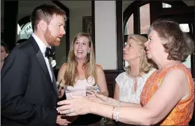  ??  ?? Groomsman Sandy and Kate Evans of San Jose, Calif.; Theresa Baker of Hilton Head, S.C.; and Boone Bullington of Houston