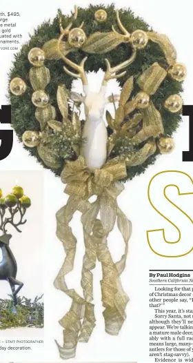  ?? COURTESY OF POLYVORE.COM MARK RIGHTMIRE — STAFF PHOTOGRAPH­ER ?? This stag wreath, $495, consists of a large lacquered white metal stag head with gold antlers accentuate­d with vintage gold ornaments. A stag candle holiday decoration.