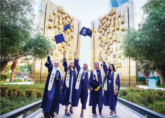  ?? AFP ?? Kuwaiti students (above) celebrate graduation amid regional concerns about skills shortages among teaching staff.