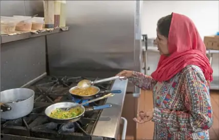  ?? Pittsburgh Post-Gazette ?? Iqbal Chatha prepares dal masoor, a red lentil stew spiced with turmeric, chili and coriander, at Kabab and Curry Restaurant and Grill in Banksville.