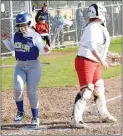  ?? Westside Eagle Observer/MIKE ECKELS ?? Bianca Arana (left) crosses home plate for the Lady Bulldogs’ first run of the game.