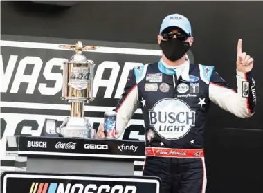  ??  ?? Race driver Kevin Harvick celebrates after winning the NASCAR Cup Series at Indianapol­is Motor Speedway on Sunday. (Photo by Darron Cummings, AP)