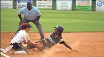  ?? / Jeremy Stewart ?? Rockmart’s T’Nia Lakes (right) slides into third base ahead of the tag by Pepperell’s Maddie Clay during the first inning of a Region 7-AA game Wednesday, Sept. 5, 2018, in Lindale.