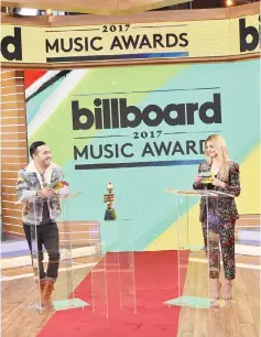  ??  ?? Fall Out Boy’s Pete Wentz and singer/songwriter Julia Michaels unveiled the nomination­s on ‘Good Morning America’ on Monday (Apr 10). — AFP photo