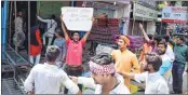  ??  ?? Activists force closure of shops at a market during “Bharat Bandh”, called over SC/ST reservatio­n issue, in Allahabad on Tuesday.