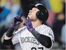  ?? DAVID ZALUBOWSKI THE ASSOCIATED PRESS ?? Colorado Rockies shortstop Trevor Story gestures after the first of his three home runs on Wednesday. Beginning with their game Friday night against the L.A. Dodgers, the Rockies face a tough September schedule as they try to win their first NL West division title.