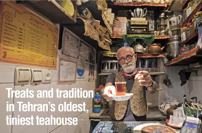  ?? ?? Owner Kazem Mabhutian, 63, serves tea at the smallest and oldest teahouse tucked away in an alleyway of the Grand Bazaar in Tehran, Iran. — All photos/AFP