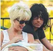  ??  ?? Paula Yates and Michael Hutchence pictured with daughter Tiger Lily in 1999.