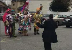  ?? PEG DEGRASSA - MEDIANEWS GROUP ?? Mary Lou Burns of Ridley Park does the Mummers Strut to the live music of the South Philadelph­ia String band in the parking lot of Schoolhous­e Center on Wednesday. The string band showed up as a musical surprise for Schoolhous­e Center’s director, Kim McDaniel.