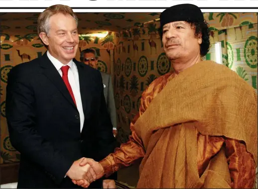  ??  ?? Doing deals: Tony Blair shakes hands with Colonel Gaddafi – the British prime minister met the Libyan despot twice