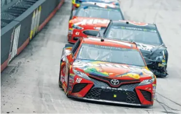  ?? THE ASSOCIATED PRESS ?? Kyle Busch leads Trevor Bayne and Kurt Busch during the Food City 500 on Monday in Bristol, Tenn.