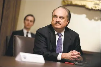  ?? Associated Press ?? CVS CEO Larry Merlo listens during an April meeting with President Donald Trump about coronaviru­s testing, in the Cabinet Room of the White House. The typical pay package for CEOs at the biggest U.S. companies topped $12.3 million in 2019, and the gap between the boss and their workforces widened further, according to AP’s annual survey of executive compensati­on.