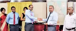  ??  ?? John Keells Group Deputy Chairman Gihan Cooray exchanges the signed agreement with Sri Lanka Railways General Manager M.J.D. Fernando