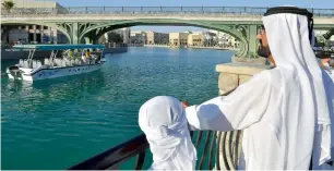  ?? Wam ?? Shaikh Mohammed takes in sights of Riverland that connects the four parks of Dubai Parks. —
