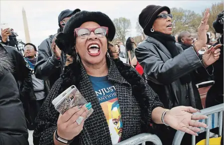  ?? JACQUELYN MARTIN THE ASSOCIATED PRESS ?? Wearing a T-shirt commemorat­ing Martin Luther King Jr., Debra Payne, of Kansas City, Mo, sings at a rally in Washington,D.C.