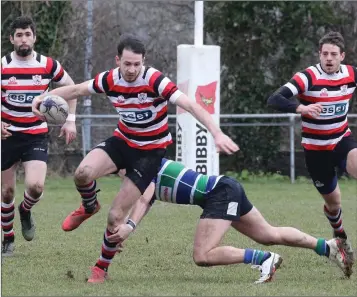  ??  ?? Enniscorth­y’s Ivan Jacob evades a tackle by Gorey’s Stephen Horan at Ross Road on Sunday.