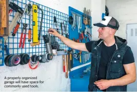  ?? Dreamstime/TNS ?? A properly organized garage will have space for commonly used tools.