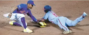  ?? FRANK FRANKLIN II/AP ?? New York Mets shortstop Francisco Lindor tags out Washington’s Alex Call on a stolen-base attempt during Thursday night’s game in New York.