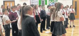  ??  ?? Stamp It Out Children from St Cadoc’s and Cairns Primary Schools, recording their anti-sectarian and anti-bullying song Stamp It Out