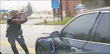  ?? Contribute­d photo ?? This still image from police dash camera video released May 3, 2019, by the Hartford State's Attorney shows Police Officer Layau Eulizier pointing his weapon at a car being driven by Anthony Jose Vega Cruz during an attempted traffic stop April 20, 2019, in Wethersfie­ld. Eulizier shot through the windshield, striking Vega Cruz, who died two days later at a hospital.