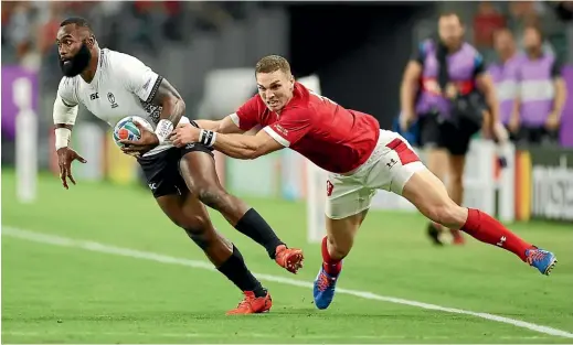  ?? GETTY IMAGES ?? European leagues are stacked with Pacific Island talent such as Fiji’s Semi Radradra, here scragged by Wales wing George North during the World Cup in Japan last year.