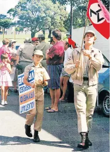  ?? /Daily Dispatch ?? White might: The Afrikaner Weerstands­beweging used to be active in East London. Here members march after an attack at the Highgate Hotel in Cambridge in May 1993.