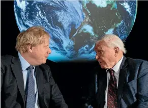  ?? GETTY IMAGES ?? Boris Johnson speaks with Sir David Attenborou­gh at London’s Science Museum during the launch of the COP26 United Nations Climate Summit, which will be held in Glasgow later this year.