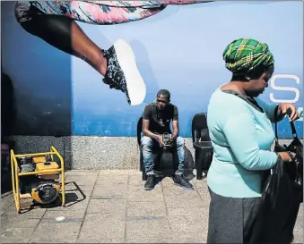  ?? Picture: ALAISTER RUSSELL ?? GENERATING SALES: A generator used to power a shop in the Johannesbu­rg CBD sits outside on the pavement. Businesses have invested in generators so that they can keep open when frequent electricit­y cuts take place in the city. Some outages have been...