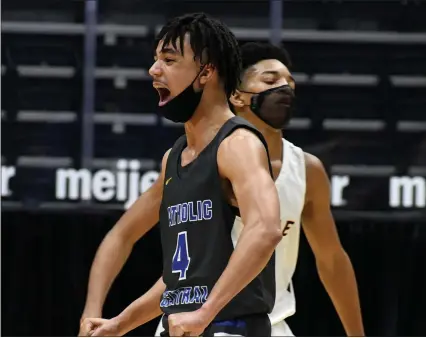  ?? PHOTOS BY DREW ELLIS — MEDIANEWS GROUP ?? GRCC’s Kaden Brown (4) celebrates during the Cougars’ 28-0 run in the second half of their 81-55 win over Ferndale in the Division 2 boys basketball semifinal played at Van Andel Arena in Grand Rapids.