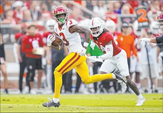  ?? Godofredo A. Vasquez
The Associated Press ?? Southern California wide receiver Jordan Addison leaves Stanford safety Patrick Fields in his wake on a 22-yard touchdown catch in the first quarter of the Trojans’ 41-28 win Saturday at Stanford Stadium. Addison totaled seven catches for 172 yards.