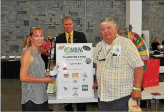  ?? PHOTO PROVIDED ?? The 8th Annual Taste of Malta was hosted recently by Hudson Valley Community Center at their TECSMART facility located in Malta. Shown here is event chair Karen McGowan, Walt Adams and Jack O’Rourke. Each year the event is coordinate­d by the Malta...