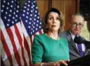  ?? THE ASSOCIATED PRESS ?? House Minority Leader Nancy Pelosi of Calif. with Senate Minority Leader Charles Schumer of N.Y. speaks to reporters about President Donald Trump’s first 100 days, Friday, April 28, 2017, during a news conference on Capitol Hill in Washington.