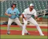  ?? RANDY MEYERS — THE MORNING JOURNAL ?? Jeff Cardenas of the Grizzlies takes his lead off of first behind Crushers first baseman Cody Lenahan on Aug. 2.