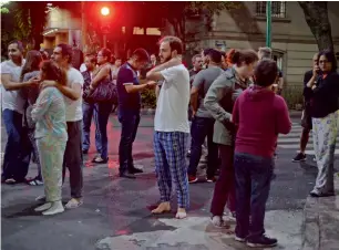  ?? AFP ?? Panicked residents on a street in downtown Mexico City during the earthquake on Friday. —