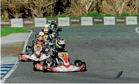  ??  ?? Auckland’s Daniel Kinsman leads the pack during a race at the Kartsport New Zealand national sprint championsh­ips at Invercargi­ll’s Sandy Point Domain at the weekend.