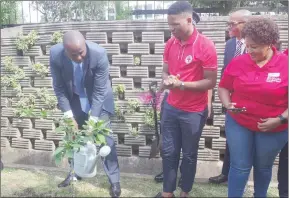 ?? Nonduduzo Kunene) (Pic: ?? Prime Minister Russell Dlamini planting a tree at Hilton Garden Inn, in Mbabane, as part of the initiative to combact climate change.