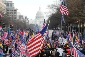  ?? (AP Photo/ Luis M. Alvarez, File) ?? In this Saturday, Dec. 12, 2020, file photo, with the U.S. Capitol building in the background, supporters of President Donald Trump stand along Pennsylvan­ia Avenue during a rally at Freedom Plaza, in Washington. Vandalism at four downtown Washington churches after rallies in support of Trump are exposing rifts among people of faith as the nation confronts bitter post-election political divisions.