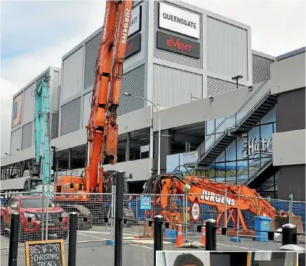  ?? PHOTOS: FAIRFAX NZ ?? Main, a view of the soon-to-be demolished section of Queensgate Shopping Centre; right, Buzz Cafe owner Michael Gray has been shut out of his smaller cafe, which is in the quake-affected portion of the mall.